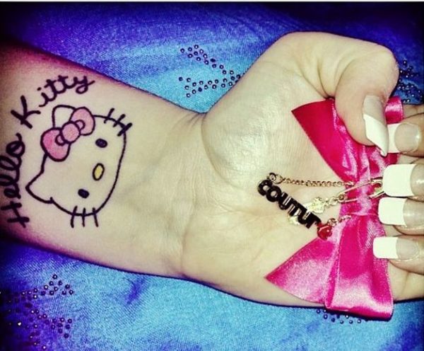 Simple and beautiful kitty Wrist Tattoo