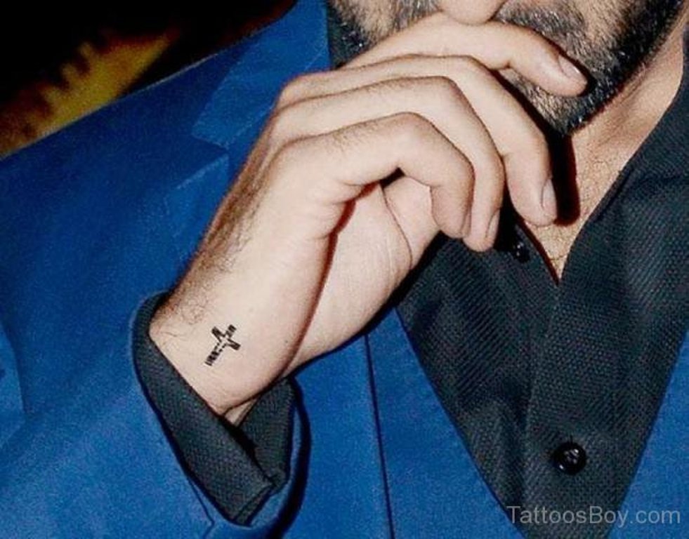 Graceful Cross Tattoo On Wrist.