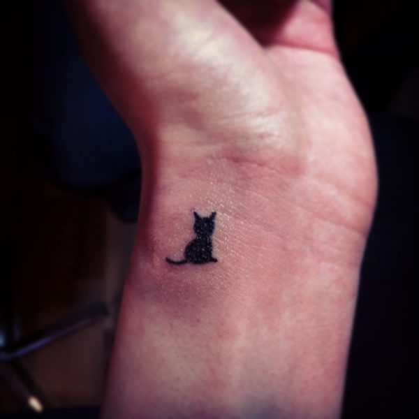 Tiny  Cat Tattoo On Wrist