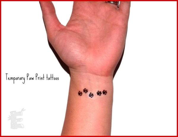 Tiny Paw Tattoo On Wrist