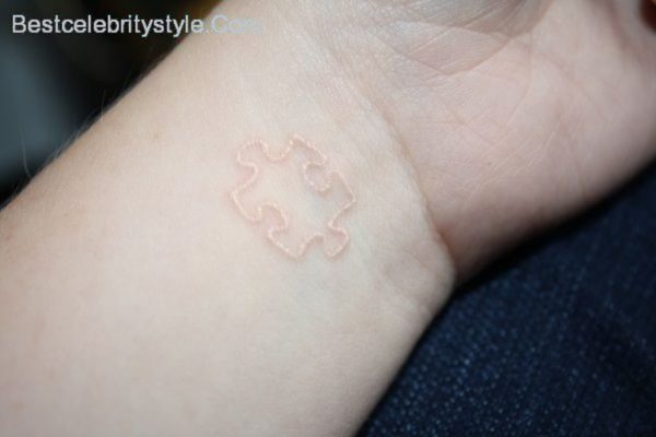 White Ink Wrist Tattoo