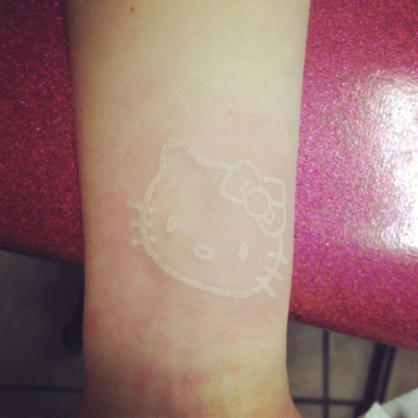 White Ink kitty Wrist Tattoo