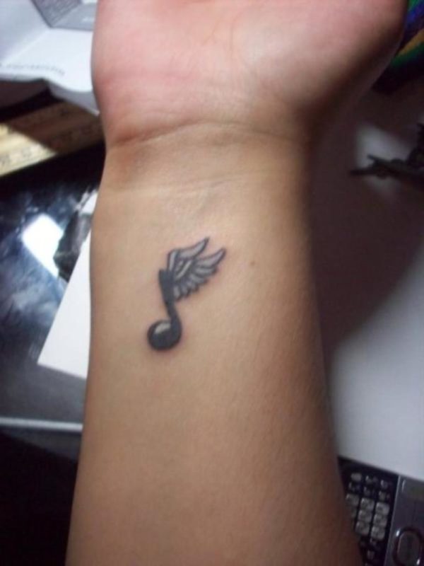 Winged Music Note Tattoo