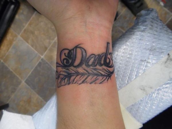 Word And Feather Tattoo