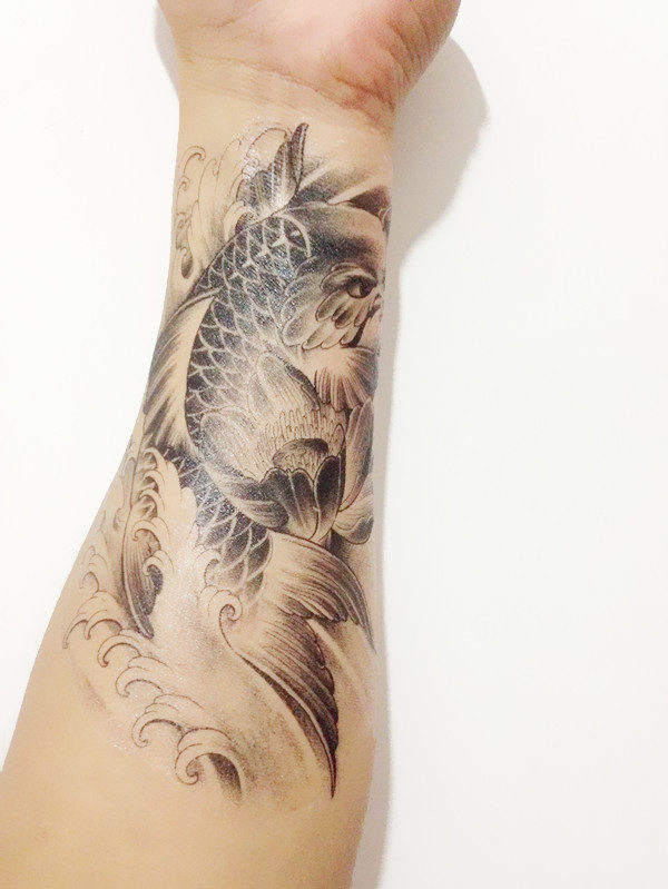 Adorable Fish Tattoo On Wrist