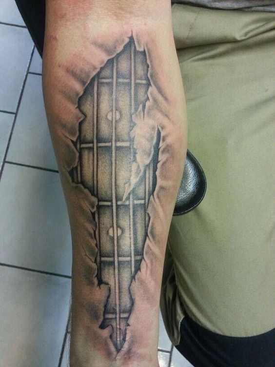Adorable Ripped Guitar Tattoo