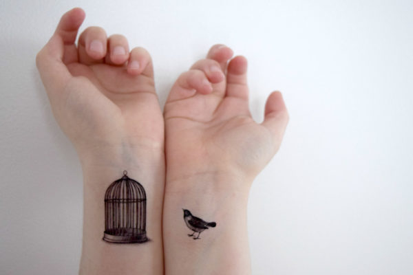 Beautiful Bird And Cage Tattoo On Wrist