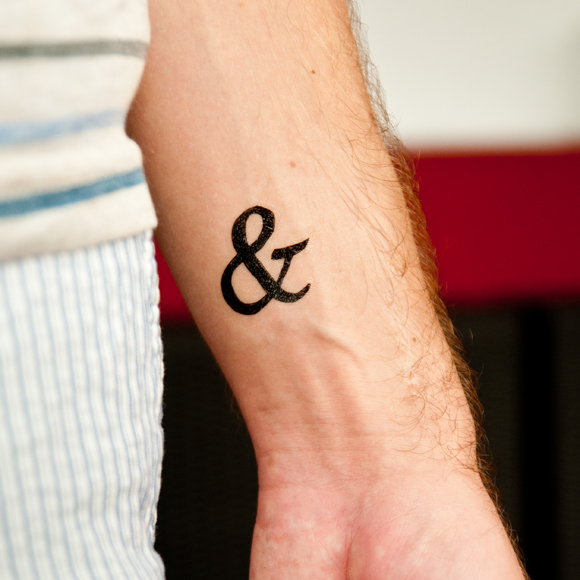 Black Ampersand Wrist Tattoo