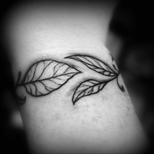 Black And White Leaves Tattoo On Wrist