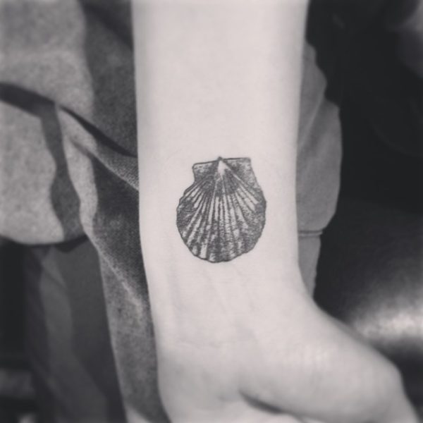 Black And White Seashell Tattoo On Wrist