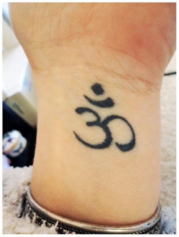 Black Om Tattoo On Wrist