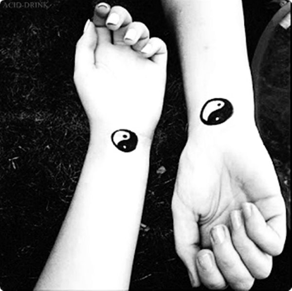 Black Yin Yang Tattoo On Couple Wrist