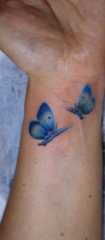 Blue Butterflies Tattoo On Wrist