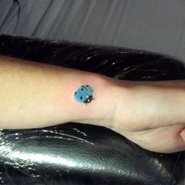 Blue Ladybug Tattoo On Wrist