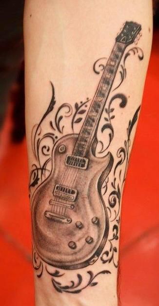 Brown Guitar Tattoo On Wrist