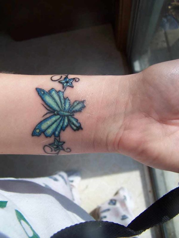 Cool Blue Butterfly Tattoo On Wrist