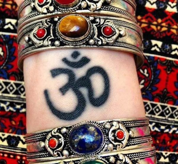 Cute Om Tattoo On Wrist