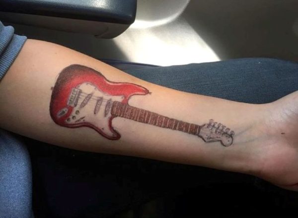 Cute Red Guitar Tattoo On Wrist