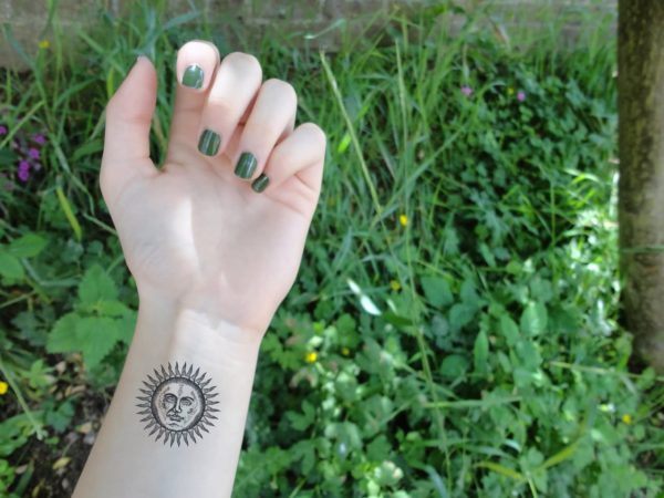 Cute Sun Tattoo On Wrist