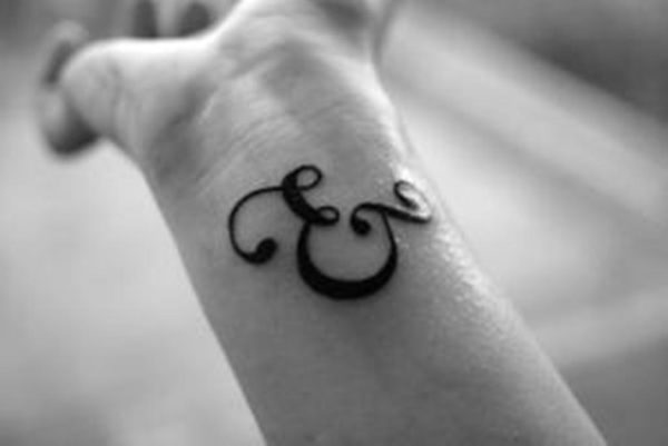 Dark Ampersand Wrist Tattoo