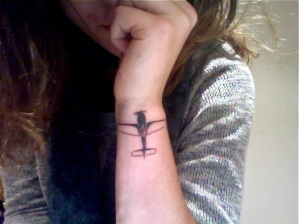 Elegant Plane Tattoo On Wrist