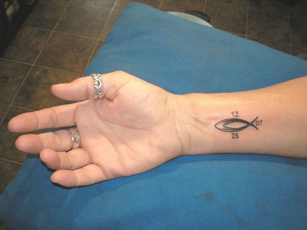 Elegant Fish Tattoo On Wrist'