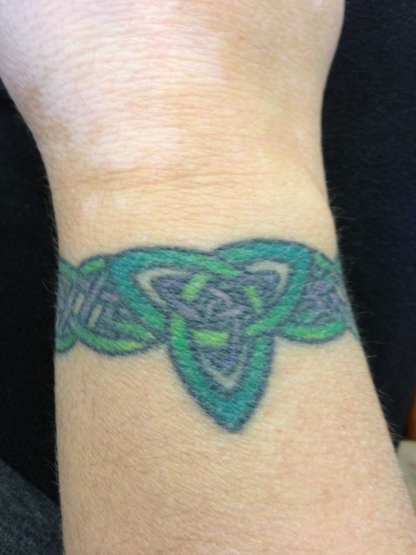 Green Celtic Tattoo On Wrist