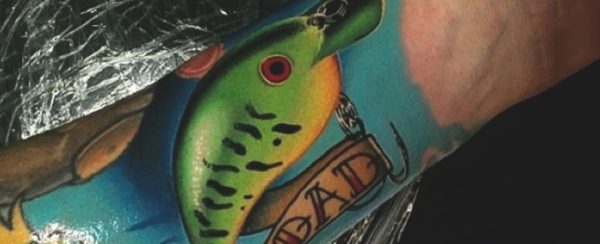 Green Fish Tattoo On Wrist
