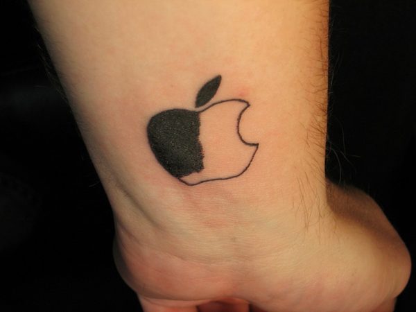 Half Black Apple Tattoo On Wrist