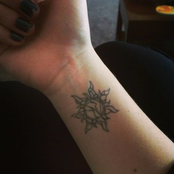 Impressive Sun Tattoo On Wrist