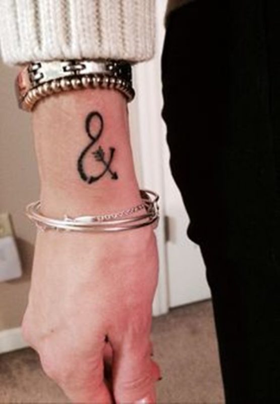 Infinity With Arrow Tattoo On Wrist