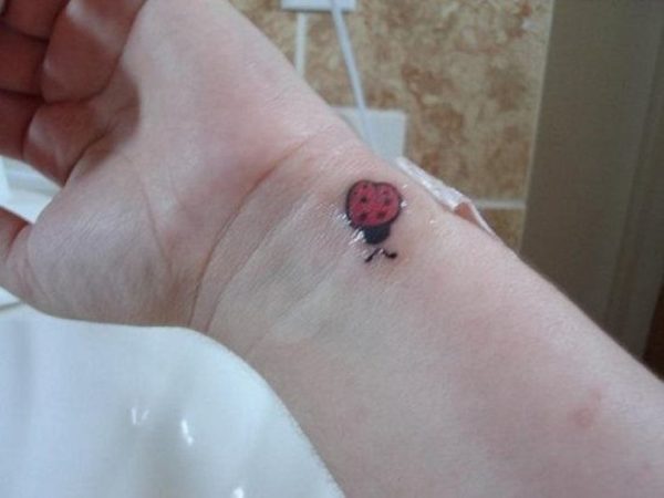 Ladybug Tattoo On Left Wrist
