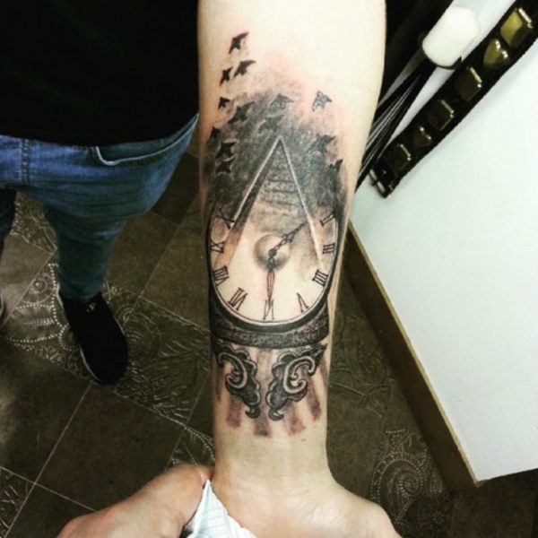 Large Black Clock Tattoo On Wrist