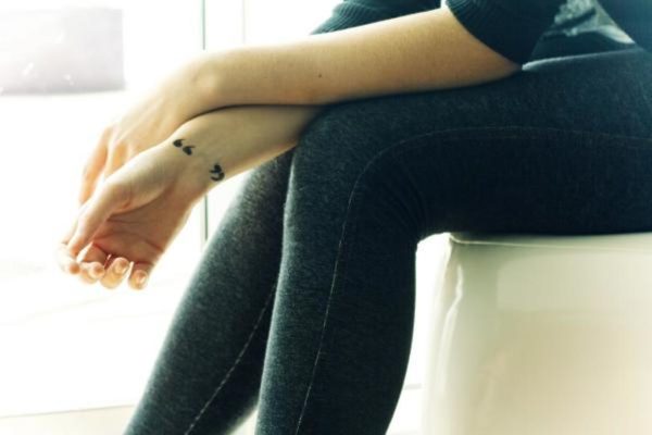 Large Quotation Mark Tattoo On Wrist