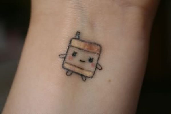 Little Cartoon Tattoo On Wrist