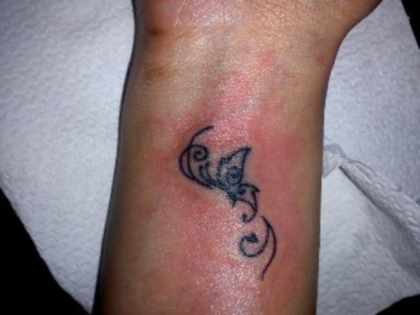 Little Tribal Butterfly Tattoo On Wrist