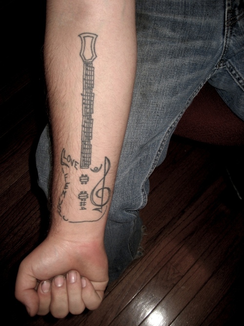 Lovely Guitar Tattoo On Wrist