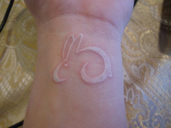 Nice White Rabbit Tattoo On Wrist