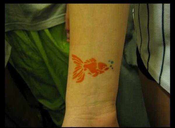 Orange Fish Tattoo On Wrist
