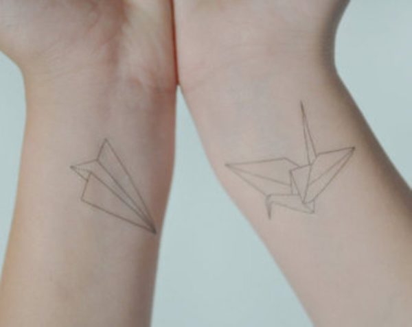 Paper Plane Wrist Tattoo