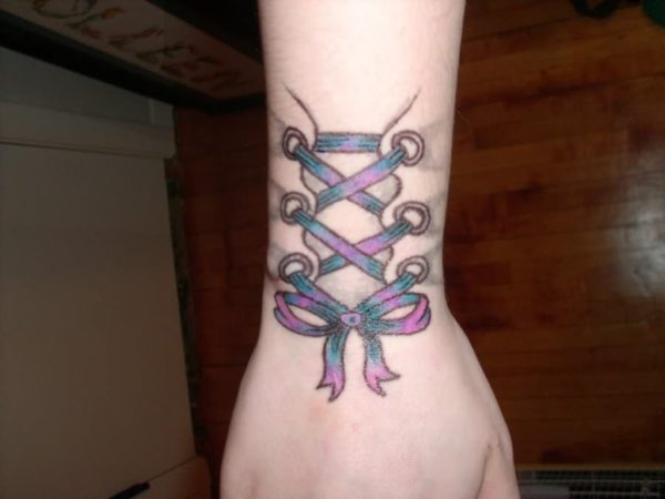 Purple Corset Wrist Tattoo