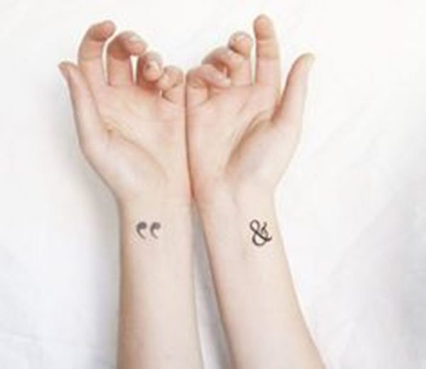 Quotation Mark And Symbol Tattoo On Wrist