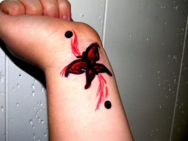 Red Butterfly Tattoo On Wrist