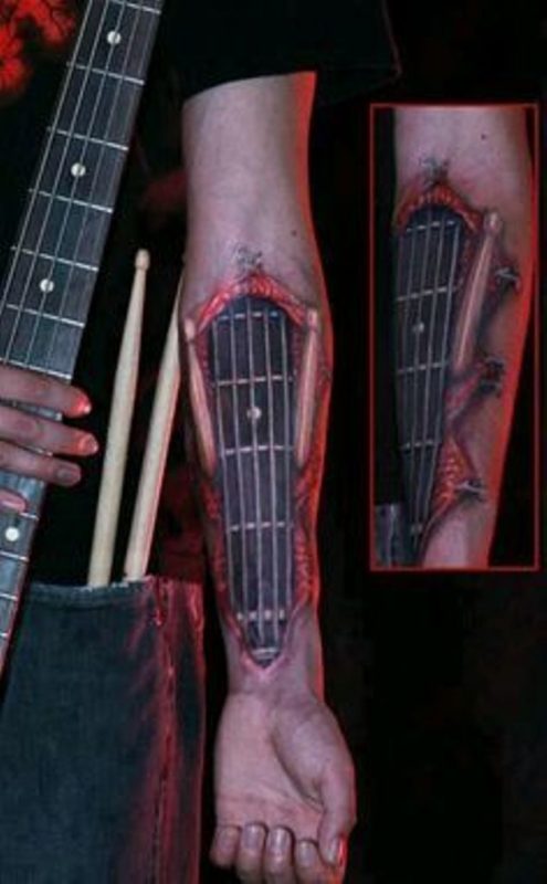 Ripped Skin Guitar Wrist Tattoo