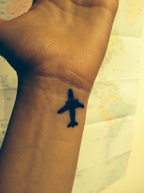 Simple Plane Tattoo On Wrist