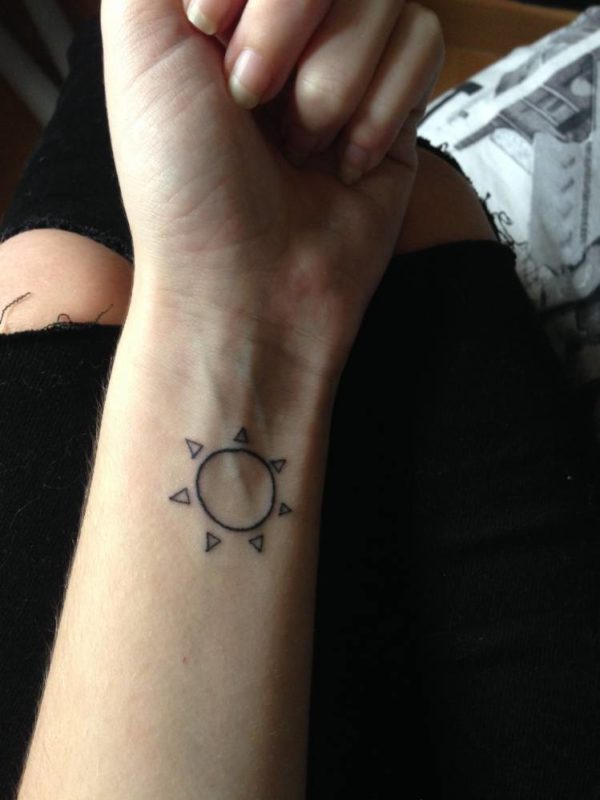 Simple Sun Tattoo On Wrist