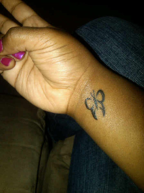 Small Black Butterfly Tattoo
