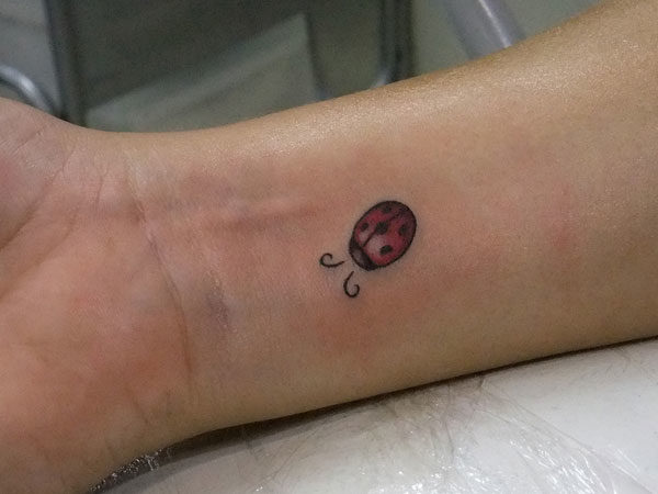 Small Ladybug Wrist Tattoo