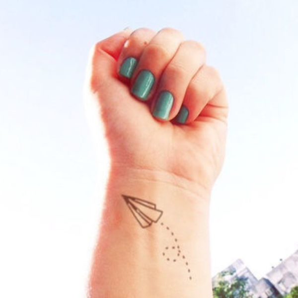Small Paper Plan Tattoo On Wrist