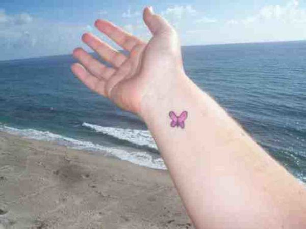 Small Pink Butterfly Tattoo On Wrist